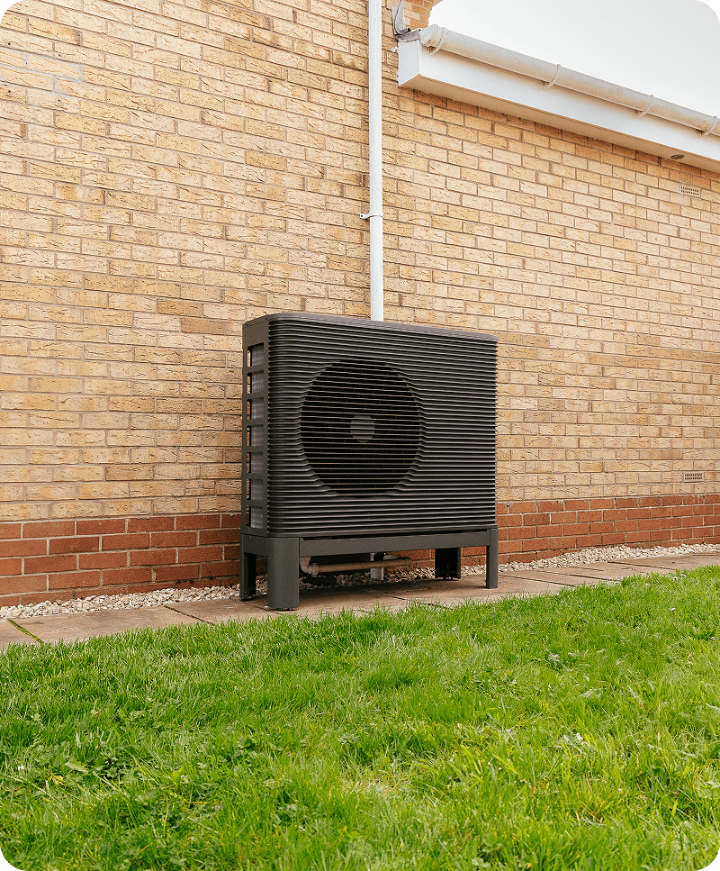 Aira Heat Pump in front of brick wall