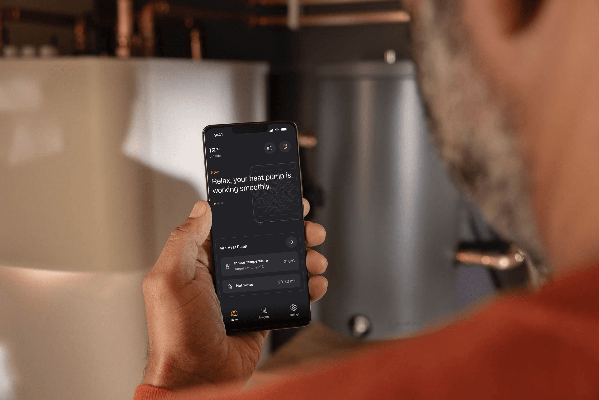 A person holding a phone with the Aira app