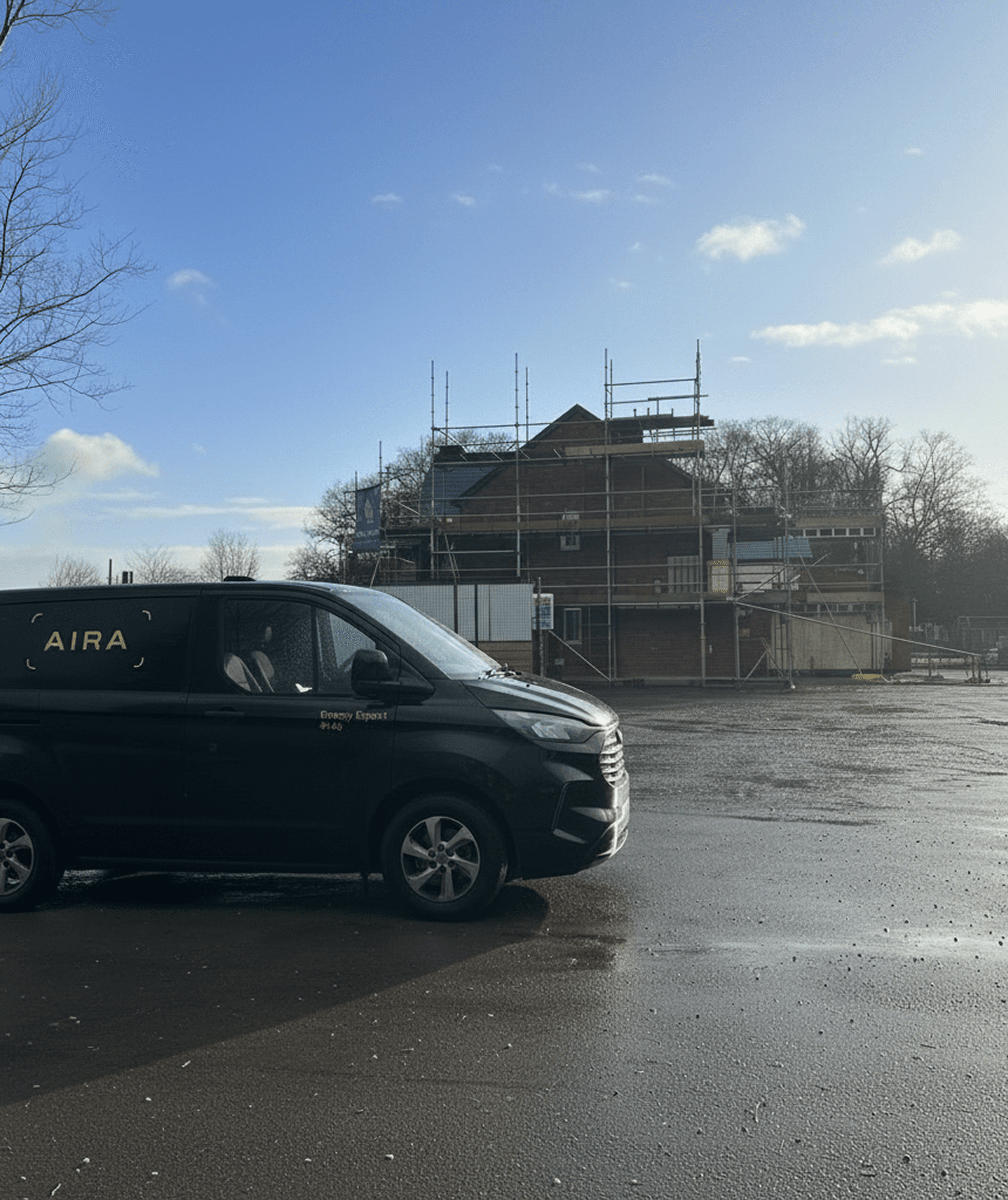 Black Aira van outside a housing development